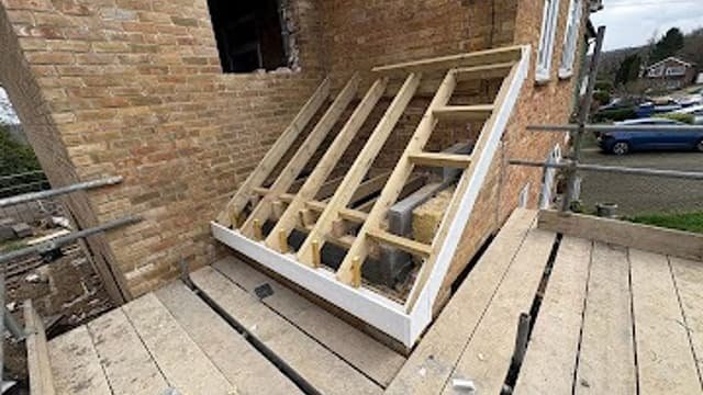 Dormer roof structure being framed during a loft conversion by Kingdom Build